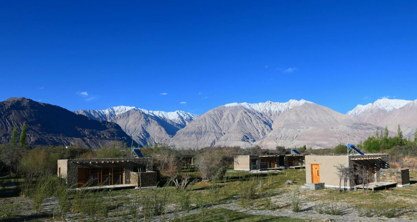 Chalets with mountain backdrop