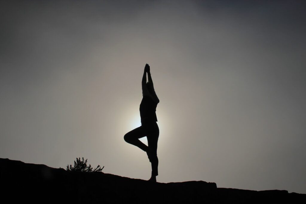 Silhouette of a woman doing a yoga pose